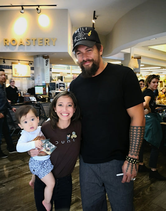 Jason Momoa with Tribalyfe artist Winky at a signing event.